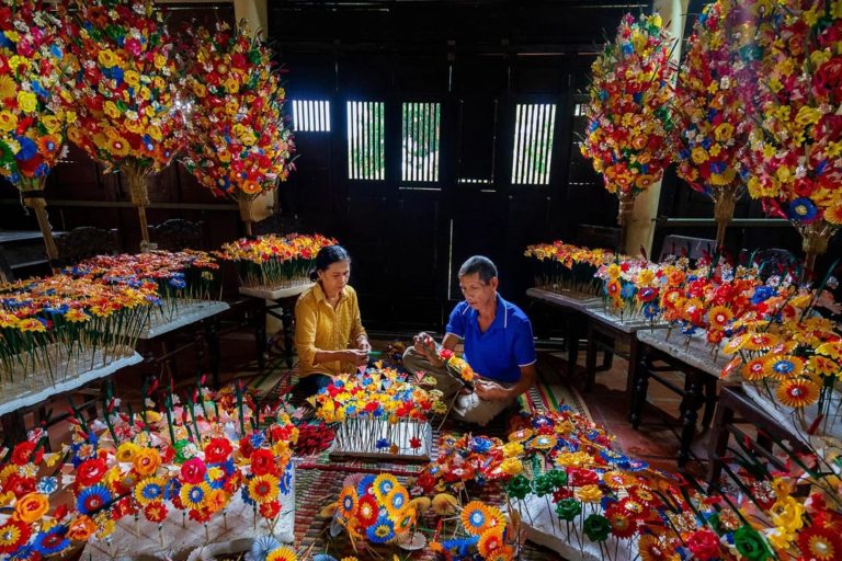 Artisans crafting paper flowers at Thanh Tien traditional craft village in Hue