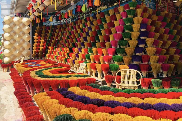 Colorful incense sticks arranged in artistic patterns at Thuy Xuan incense-making village in Hue, a popular destination for traditional craft village tourism