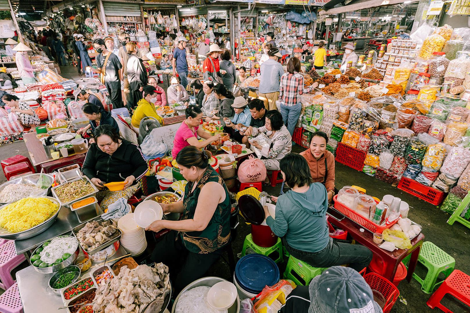 Bustling dining court with street snacks and dried Da Nang specialties at Con Market