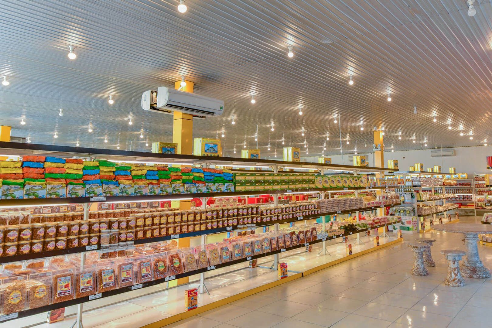Organized shelves of boxed and sealed Da Nang specialties at Huong Da store