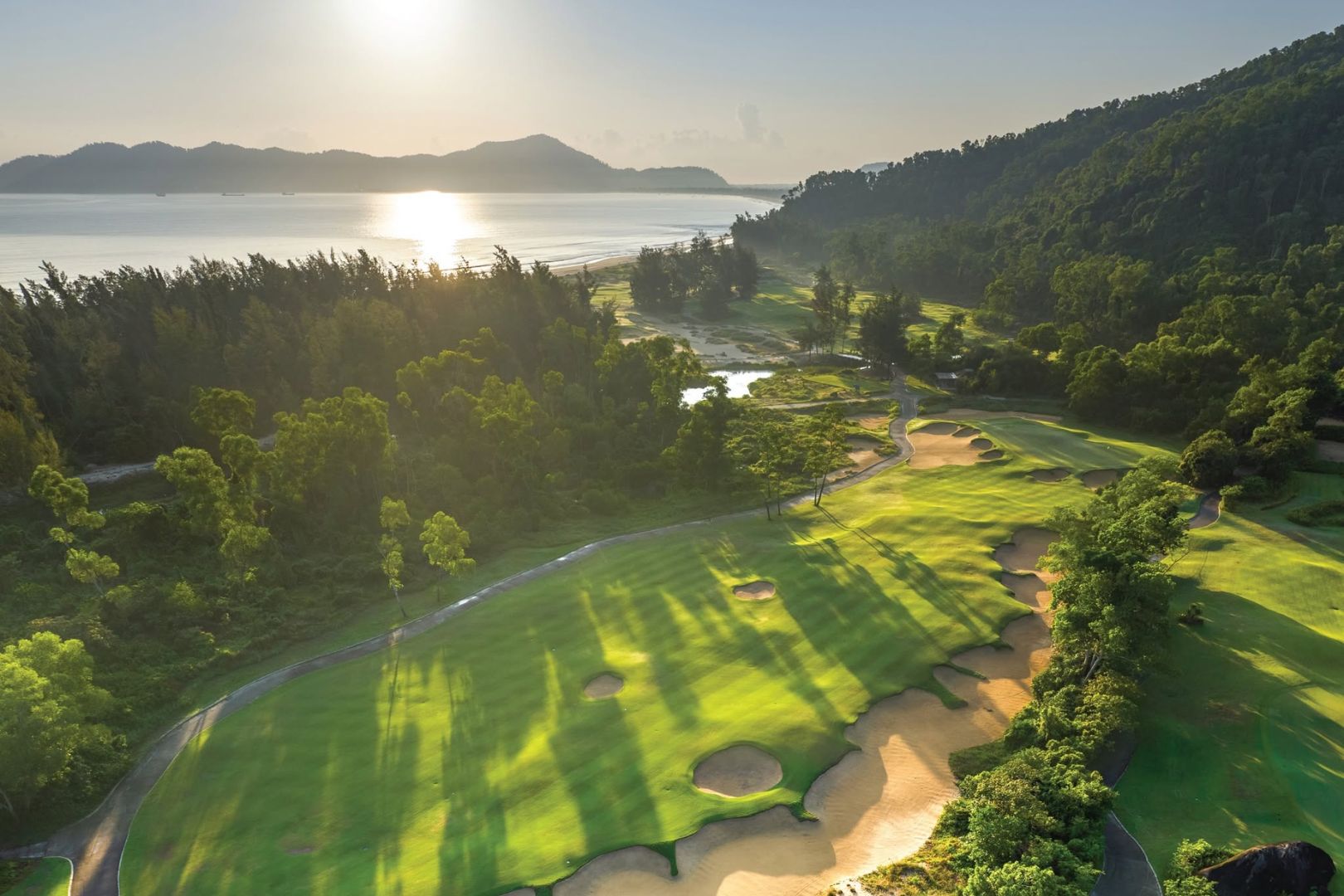 Laguna Golf Lăng Cô driving range surrounded by the Truong Son Mountains