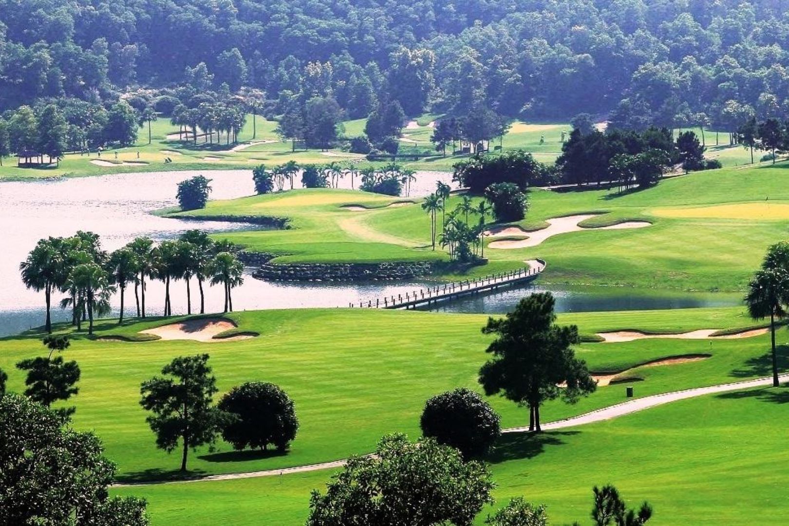 Tam Dao Golf Resort practice range surrounded by green mountains